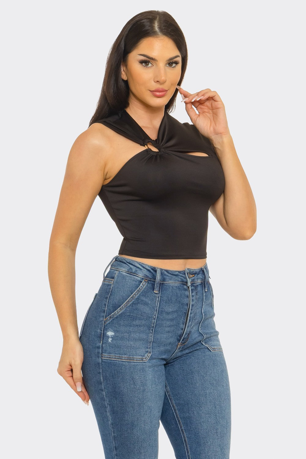 Twisted cutout ring crop top in black — side angle view