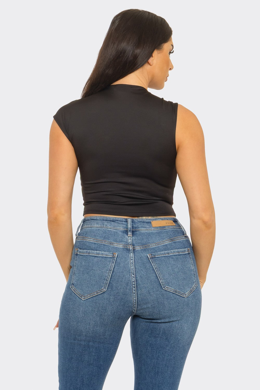 Twisted cutout ring crop top in black — back view